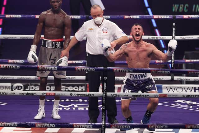 Mikey McKinson, right, falls to the floor after finding out he's victorious. Picture: Mark Robinson/Matchroom Boxing