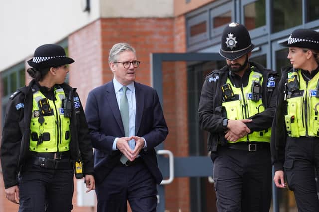 Prime Minister Sir Keir Starmer speaks with police. Credit: Joe Giddens/PA Wire