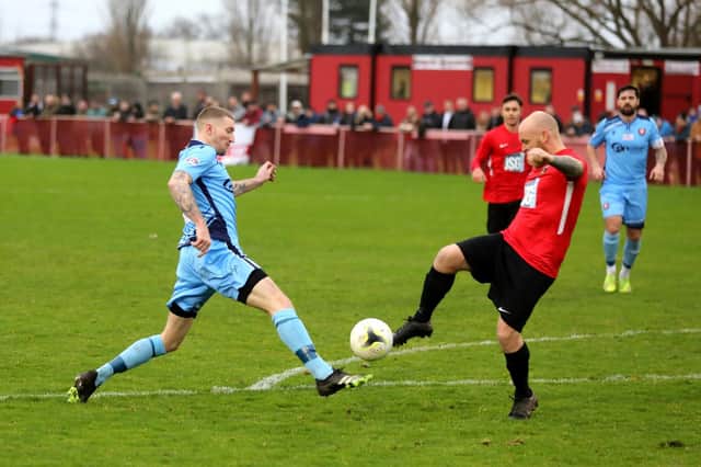 Fareham Town's Ash Tattersall, right, and AFC Portchester's Lee Wort battle for the ball. Picture: Sam Stephenson