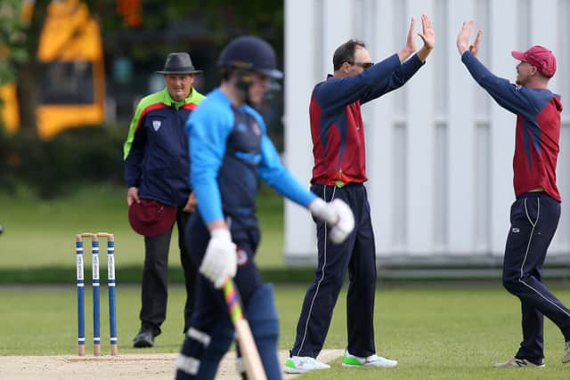 Havant's Richard Hindley, second right, has just taken another Bashley wicket. Picture: Chris Moorhouse