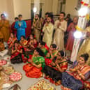 Onlookers particpiate in a mantra during the Diwali celebrations at Fratton Community Centre. Picture: Mike Cooter (041121)