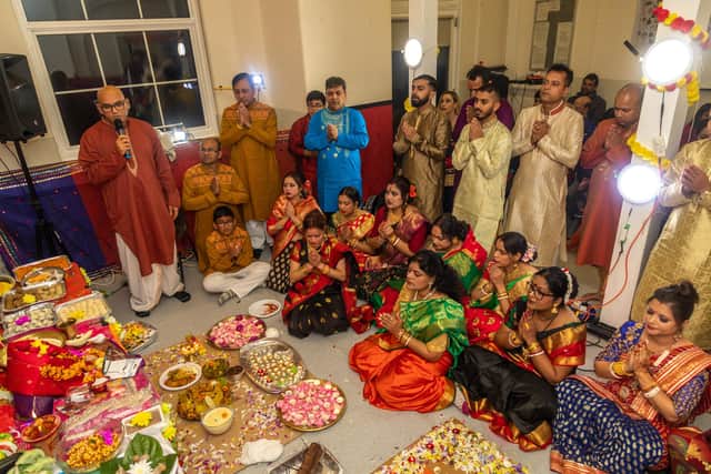 Onlookers particpiate in a mantra during the Diwali celebrations at Fratton Community Centre. Picture: Mike Cooter (041121)