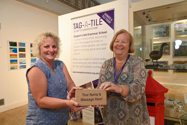 Venue manager, Wendy Redman and Gosport Gallery volunteer, Vivienne Buffery, with one of the tiles. Picture: Hampshire Cultural Trust