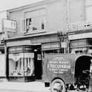 Some very old shops in Cosham High Street, with the lending library on the left.