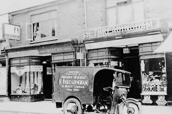 Some very old shops in Cosham High Street, with the lending library on the left.
