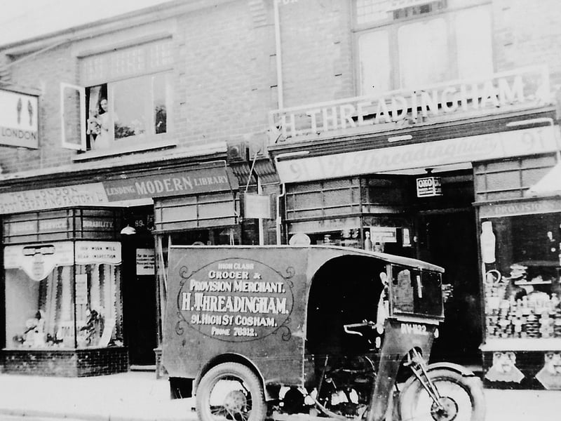 Some very old shops in Cosham High Street, with the lending library on the left.