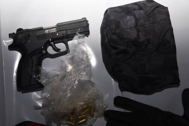 The contents of the Gucci bag, including a 9mm gun, found close to Marius Molla