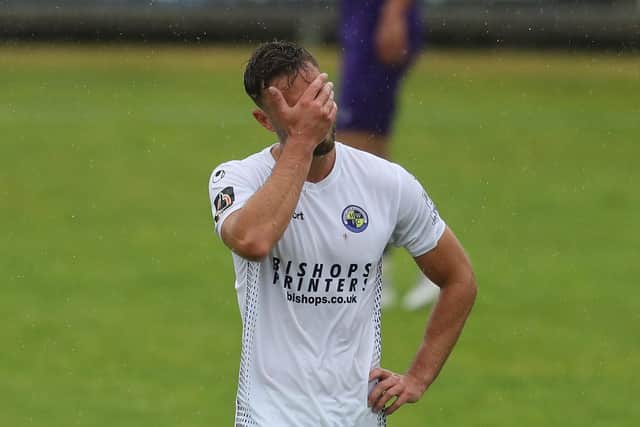 What have I done! Josh Taylor walks off after being shown the red card against Dartford. Photo by Dave Haines