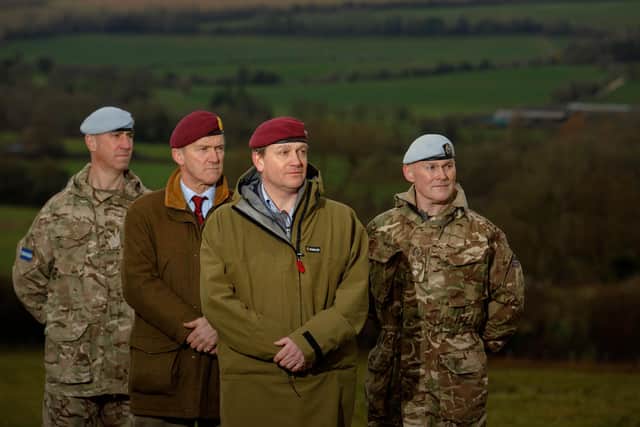 Servicemen and veterans of the Air Corps and the Parachute Regiment, (L-R) WO1 Paul Dockrell AAC, Major General Jonathan Shaw CB, CBE PARA (retd.), Major Will Pike PARA (retd.) and Lieutenant Colonel Ewen Stuart AAC pose at the proposed site of a memorial to 33 WWII soldiers, near Warnford, Hampshire.