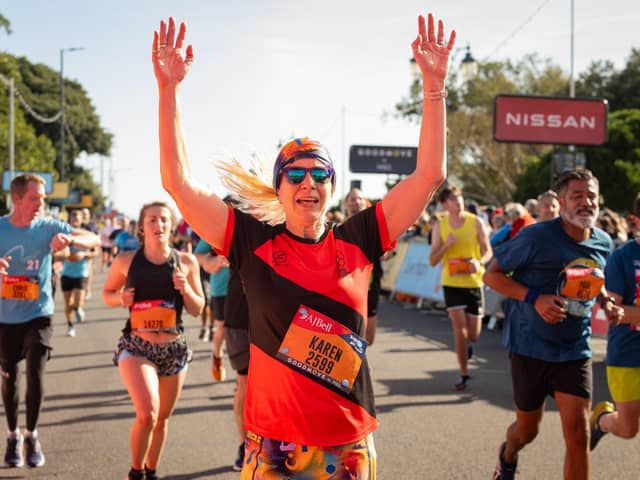 Pictured is: A runner crossing the finish line.