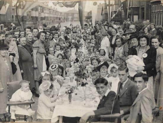 VE Day street party on Compton Road. Newborn baby, Norman Hand, is being held by his mother, Vera Hand (right of photograph).