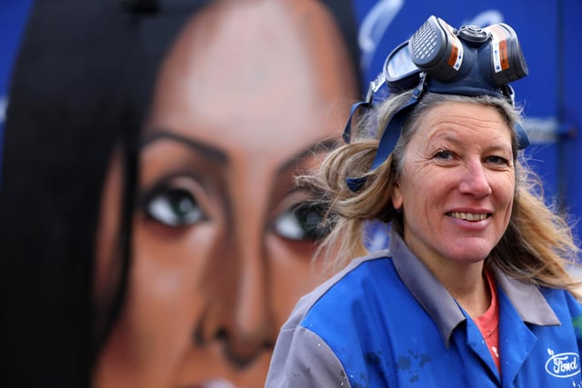 Sadie Tierney with Skank Ditchener's work. Local artists working on the wall behind Hilsea Lido. Picture: Chris Moorhouse (jpns 250223-27)