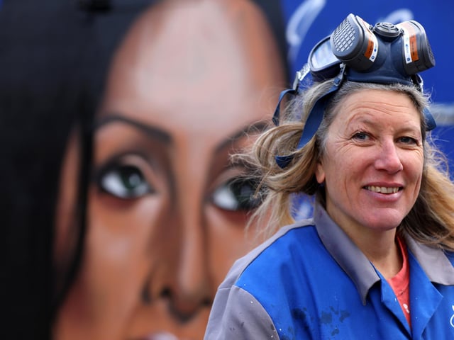 Sadie Tierney with Skank Ditchener's work. Local artists working on the wall behind Hilsea Lido. Picture: Chris Moorhouse (jpns 250223-27)