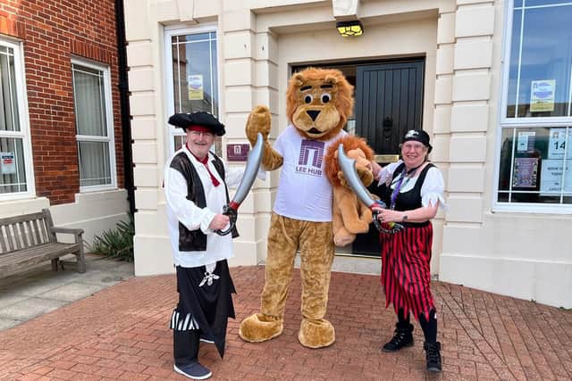 From left: Norman Macintosh, Lee Hub's mascot Rory the Lion, and Hellen Bach. 