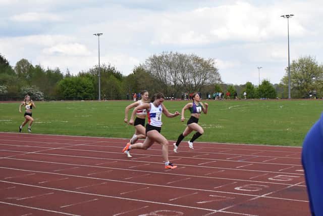 City of Portsmouth AC's Lily Baggott on her way to setting a new club 100m girls distance record at Hillingdon