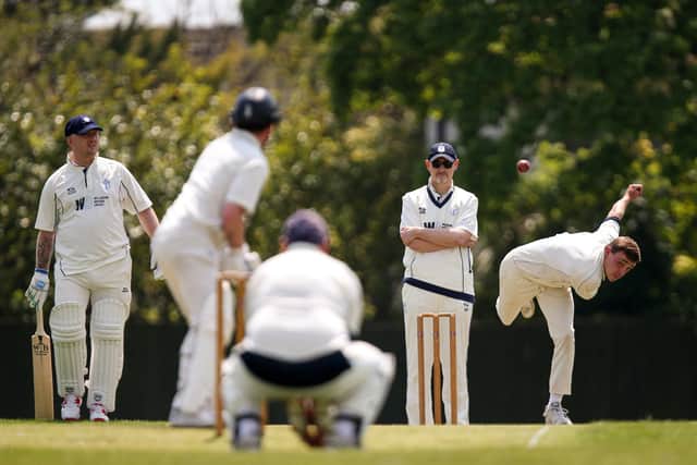 Billy Whythe bowling for Hayling Island against Portsmouth Community. Picture: Chris Moorhouse