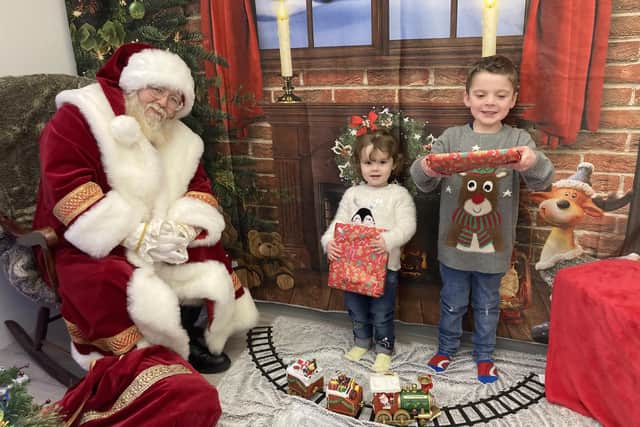 Sister and brother Rosanna, two, and Eddie, four, Morton meet Father Christmas at Little Big Village