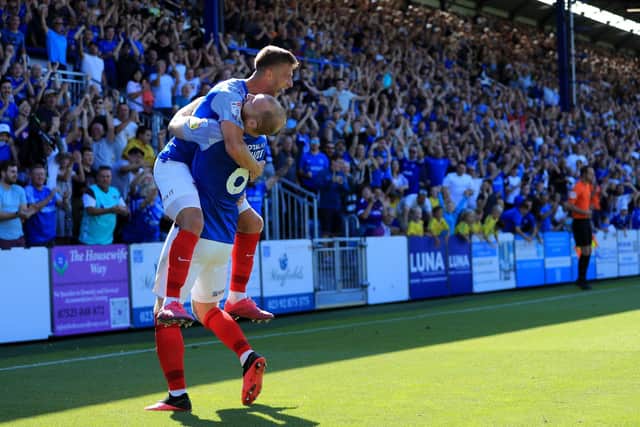 Portsmouth defender Connor Ogilive (6) celebrates his goal with Portsmouth midfielder Michael Jacobs (24) during the EFL Sky Bet League 1 match between Portsmouth and Bristol Rovers at Fratton Park, Portsmouth, England on 20 August 2022.