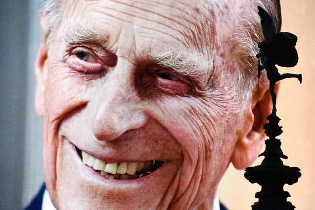 Prince Philip, Duke of Edinburgh's death is displayed on the large screen at Piccadilly Circus on April 09, 2021 in London, United Kingdom. Photo by Jeff Spicer/Getty Images.
