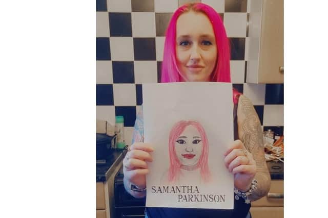 Samantha Parkinson pictured with her self portrait.
