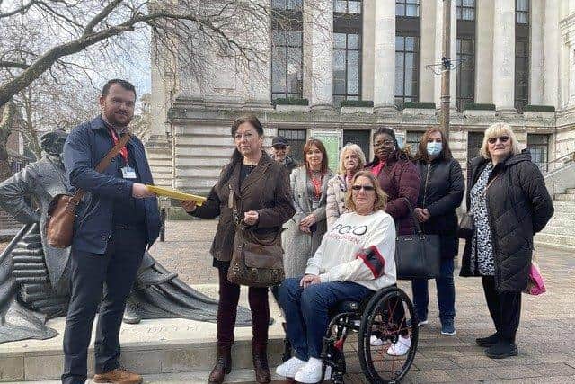 A petition being handed over in Guildhall Square, Portsmouth about the lack of doctors at the John Pounds medical centre in Portsea