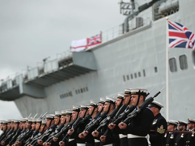 Company of the HMS Illustrious stand in formation during her decommissioning ceremony on August 28, 2014 in Portsmouth. Photo by Dan Kitwood/Getty Images