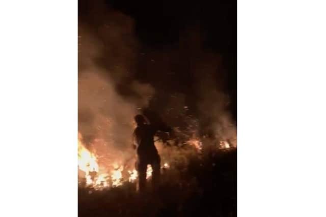 Firefighters tackling an open fire in Bordon on April 5, 2022