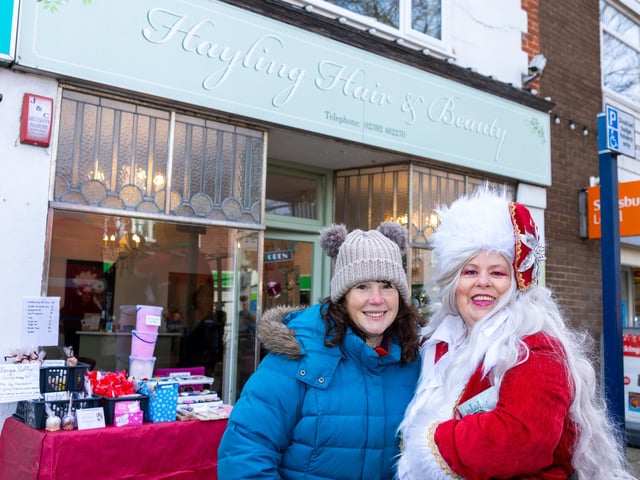 Locals braved the cold to celebrate the start of the Christmas festivites with a street party on Hayling Island on Saturday afternoon.
Pictured - Sahron Cogger, raising money for The Lilly Foundation and Julie Kirby (Santas Daughter) raising money for the RNLI.
Photos by Alex Shute