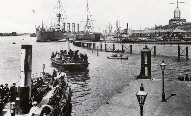A view of the dockyard about 1908 with Gosport ferries in the foreground. The railway line opened in 1876. It was built as part of the harbour extension across the foreshore of Watering Island. The jetty here was constructed in 1860 and was especially suitable for troopships