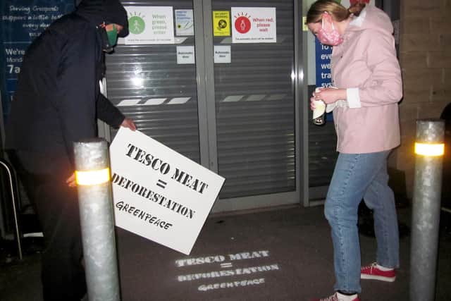 A message stencilled in yellow colour chalk, reading ‘Tesco meat = deforestation’ appears outside the supermarket’s branch in Crosspool as part of a nationwide protest at 270 stores, including two in Portsmouth. Picture: Greenpeace