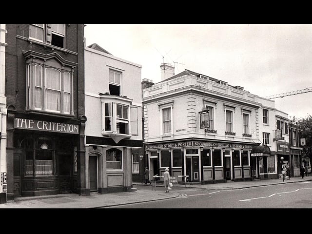 Station street 1973. It is December 1973 and we have four places to have a drink within fifty yards. To the left is the Criterion, then the Claremont Hotel. Crossing Station Street we have Judds Railway Hotel and then a restaurant, a fancy goods shop and another pub, the Lennox Arms. To the left of the Criterion is a tobacconist and then another pub, the Albany. The crane would be working on the beginnings of the new civic offices in Guildhall Square. The junction of Station Street and Commercial Road in December 1973.