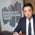 Havant MP Alan Mak signs the Holocaust Educational Trust’s Book of Commitment in Parliament