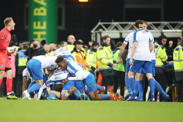 Pompey's player celebrate Andre Green's last-gasp winner at Norwich in a January 2019 FA Cup fixture: Joe Pepler