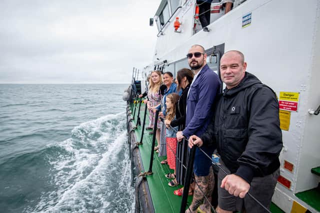 Pictured: Alan Week' s family on the tug boat as they prepare to honour one of his last wishes - committing his ashes to the Solent. 

Picture: Habibur Rahman