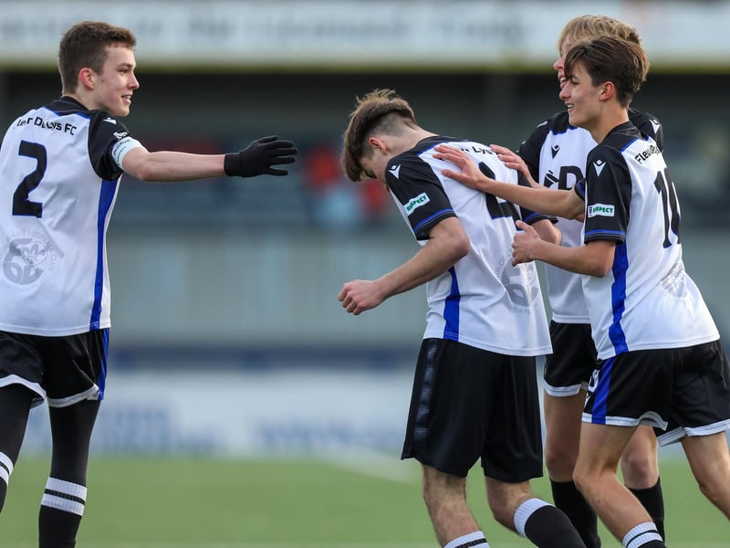 Jayden Woods, second left, celebrates his winning goal for Fleur de Lys Victory. Picture: Chris Moorhouse