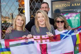 England fans gathered at the Milton Arms in Portsmouth on Sunday evening to watch England's opening game against Serbia in Euro 2024.Pictured - Tracey Ford, Landlady Christina Sloan, Landlord Dan Smith and fan Gemma WilliamPhotos by Alex Shute