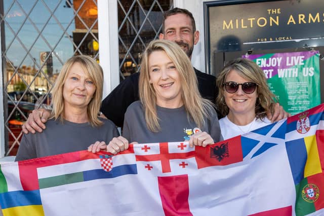 England fans gathered at the Milton Arms in Portsmouth on Sunday evening to watch England's opening game against Serbia in Euro 2024.Pictured - Tracey Ford, Landlady Christina Sloan, Landlord Dan Smith and fan Gemma WilliamPhotos by Alex Shute