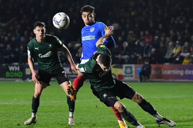 Tyler Walker battles for possession in Pompey's 1-0 defeat at Plymouth - a match in which Cowley saw positives. Picture: Graham Hunt/ProSportsImages