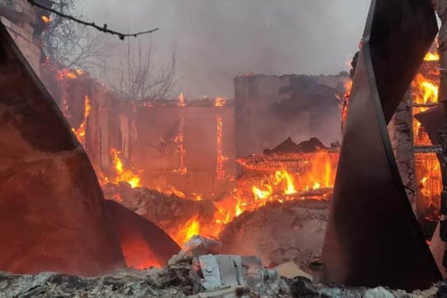 One of the building was left a flaming wreck by the Russian artillery barrage.