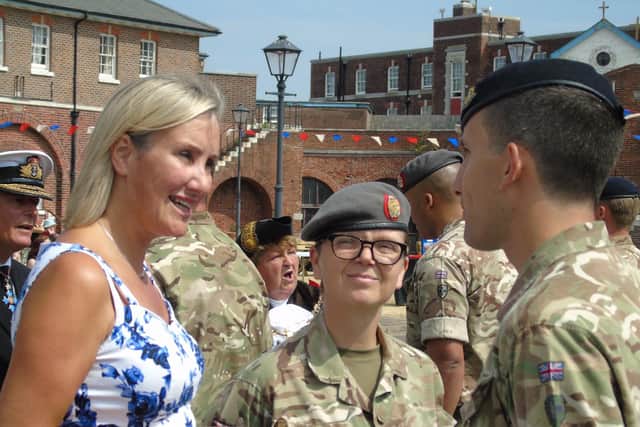 Caroline Dinenage, Gosport MP - pictured left at Fort Blockhouse with soldiers from 33 Field Hospital who used to be based at the historic fort.