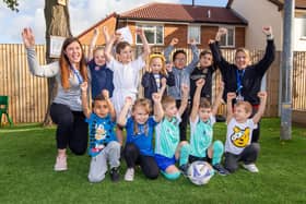 The football-themed Children in Need day at Manor Infant and Junior School, Fratton. Head of Year 2, Romany Shairp and sports coach, Sarah Jepson with reception class, year 1 and year 2 pupils Picture: Habibur Rahman