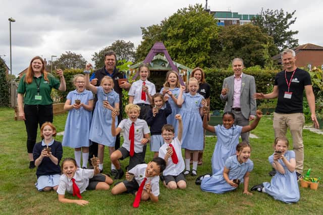 Pupils from St Alban's join Cllr  Russell Oppenheimer, back row second right, alongside a representative from The Tree Council, former St Alban's pupil Annie, to the left of Cllr Oppenheimer as you look at the photo, and the Hampshire Forest Partnership