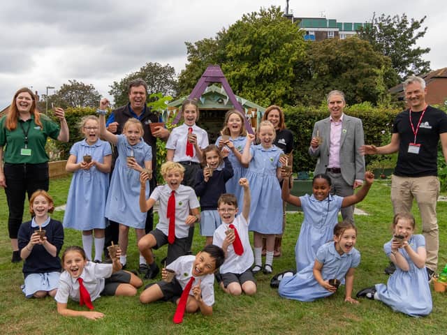 Pupils from St Alban's join Cllr  Russell Oppenheimer, back row second right, alongside a representative from The Tree Council, former St Alban's pupil Annie, to the left of Cllr Oppenheimer as you look at the photo, and the Hampshire Forest Partnership