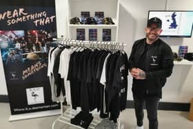 Johnny Bolderson from Knowle Village has launched clothing brand BAD Samaritan to raise awareness of mental health support. Pictured: Johnny with some the t-shirts from his range