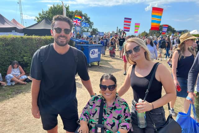 Polly Frank (centre), with her brother Ben and his wife Liz, said the festival had done a ‘a really good job’ making the site accessible. Picture: Richard Lemmer.