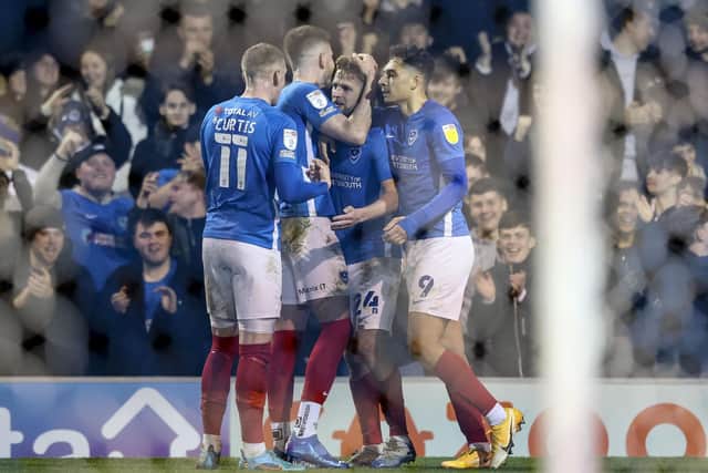 Michael Jacobs is surround by his Pompey teammates as he puts the Blues 2-0 up and was Gaffer For A Day, Reuben Alloby's man of the match.