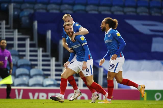Tom Naylor celebrates netting in his third-successive Pompey game after discovering a surprise goal touch. Picture: Joe Pepler