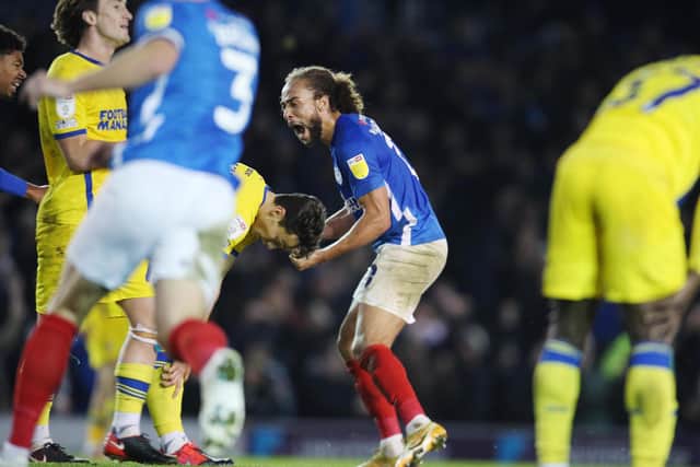 Marcus Harness roars his delight after grabbing a last-gasp winner to earn Pompey victory over AFC Wimbledon. Picture: Joe Pepler