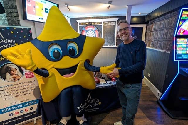 Gary Parker with charity mascot, Wishy