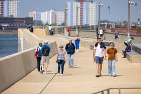 Exploring the sea defences in Old Portsmouth. Picture: Mike Cooter (110524)